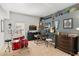 Eclectic bedroom featuring a drum set, desk, guitars, and musical decor against a two-tone wall at 5112 Jetsail Dr, Orlando, FL 32812