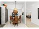 Dining room with a decorative table, chairs, hutch, and entry to other rooms at 5112 Jetsail Dr, Orlando, FL 32812