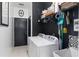 Functional laundry room featuring a washer, dryer, and storage shelves at 5112 Jetsail Dr, Orlando, FL 32812