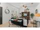 Cozy living room showcasing comfortable seating, a media center, and natural light filtering through the windows at 5112 Jetsail Dr, Orlando, FL 32812