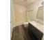 Charming bathroom featuring a vanity with marble countertop, subway tile, and sleek fixtures at 5999 Lake Pointe Dr # 602, Orlando, FL 32822