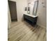 Modern bathroom featuring a double vanity with framed mirrors and neutral wall colors at 5999 Lake Pointe Dr # 602, Orlando, FL 32822