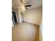 Comfortable bedroom with neutral paint, a ceiling fan, and ample closet space at 5999 Lake Pointe Dr # 602, Orlando, FL 32822