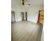 Cozy bedroom featuring neutral paint, a ceiling fan, and multiple closets at 5999 Lake Pointe Dr # 602, Orlando, FL 32822