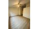 Spacious bedroom featuring wood-look flooring and neutral wall colors at 5999 Lake Pointe Dr # 602, Orlando, FL 32822
