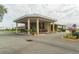 Elegant clubhouse featuring covered entrance and beautifully landscaped surroundings at 5999 Lake Pointe Dr # 602, Orlando, FL 32822