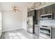 Well-lit kitchen showcasing stainless steel appliances, and light-filled breakfast area at 5999 Lake Pointe Dr # 602, Orlando, FL 32822