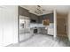 Modern kitchen with stainless steel appliances, gray cabinets, and a stylish backsplash at 5999 Lake Pointe Dr # 602, Orlando, FL 32822