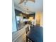 Bright kitchen with stainless steel appliances, dining area, and wood-look flooring at 5999 Lake Pointe Dr # 602, Orlando, FL 32822