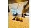 A kitchen featuring a quartz countertop, modern faucet, stainless steel sink, and appliances at 5999 Lake Pointe Dr # 602, Orlando, FL 32822