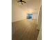 Spacious living room featuring wood-look floors and neutral wall colors at 5999 Lake Pointe Dr # 602, Orlando, FL 32822