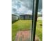 View of backyard with green grass and brick patio at 6028 Bimini Ave, Haines City, FL 33844