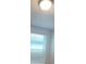 Bedroom featuring a window with blinds for adjustable light control, in a cozy and private space at 6028 Bimini Ave, Haines City, FL 33844