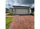 Charming single-story home with a brick driveway and well-maintained landscaping at 6028 Bimini Ave, Haines City, FL 33844