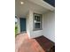 Close up of the front door with a window showing a glimpse of the interior, inviting you to step inside at 6028 Bimini Ave, Haines City, FL 33844