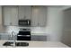 Bright kitchen with stainless steel appliances, white subway tile backsplash and ample counter space for meal preparation at 6028 Bimini Ave, Haines City, FL 33844