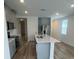 Modern kitchen featuring a large island, stainless steel appliances, and plenty of cabinet space at 6028 Bimini Ave, Haines City, FL 33844