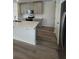 Modern kitchen with stainless steel appliances, white countertops, and grey cabinetry at 6028 Bimini Ave, Haines City, FL 33844