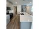 Open-concept kitchen with a large island, perfect for entertaining and everyday living, featuring stainless appliances at 6028 Bimini Ave, Haines City, FL 33844