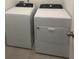 Laundry room showcasing modern, white, front load washing machine and dryer at 6028 Bimini Ave, Haines City, FL 33844