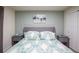 Serene bedroom with a comfortable bed, soft blue color scheme, and stylish decor at 7352 Oakmoss Loop, Davenport, FL 33837