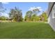 A vast, well-maintained lawn stretches out in the backyard, offering a serene and spacious outdoor environment at 75 Guava Ter, Ocklawaha, FL 32179