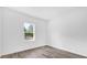 The bright bedroom features light-filled windows and neutral walls at 75 Guava Ter, Ocklawaha, FL 32179