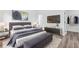 A main bedroom features stylish decor, including modern furniture, sleek lighting, and neutral artwork at 75 Guava Ter, Ocklawaha, FL 32179