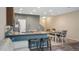 Eat-in kitchen features granite counters, a breakfast bar, and an adjacent dining area at 7660 Ripplepointe Way, Windermere, FL 34786