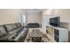 This living room offers neutral walls, a TV, a sofa, and an open floor plan at 7660 Ripplepointe Way, Windermere, FL 34786