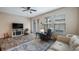Bright living room with plank flooring, recessed lighting, and sliding glass door access to outdoor space at 7660 Ripplepointe Way, Windermere, FL 34786