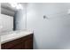 Powder room features a pedestal sink with chrome hardware and a framed mirror at 812 Marcel Loop, Davenport, FL 33837