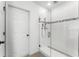 Bathroom features a glass shower with white tiling and chrome hardware at 812 Marcel Loop, Davenport, FL 33837
