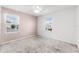 Bright bedroom with neutral walls, carpet flooring, and dual windows for natural light at 812 Marcel Loop, Davenport, FL 33837
