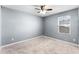 Inviting bedroom featuring neutral walls, carpet flooring, and a ceiling fan at 812 Marcel Loop, Davenport, FL 33837
