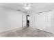Neutral bedroom with carpet flooring, closet, and ceiling fan at 812 Marcel Loop, Davenport, FL 33837