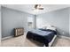 Bedroom with neutral walls, carpet flooring, and a comfortable bed at 812 Marcel Loop, Davenport, FL 33837