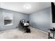 Bright bedroom featuring neutral walls, carpet flooring, and a large window for natural light at 812 Marcel Loop, Davenport, FL 33837