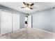 Bedroom featuring neutral walls, carpet flooring, a ceiling fan, and closet at 812 Marcel Loop, Davenport, FL 33837