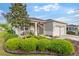 Charming single-story home with lush landscaping, front porch, and attached two car garage at 8205 Sw 78Th Terrace Rd, Ocala, FL 34476