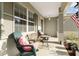Inviting covered front porch featuring comfortable seating, perfect for relaxing outdoors at 8205 Sw 78Th Terrace Rd, Ocala, FL 34476