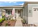 Cozy front porch area with outdoor seating, front door decor, and well-kept landscaping at 8205 Sw 78Th Terrace Rd, Ocala, FL 34476