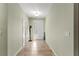 Bright hallway featuring tile floors, neutral paint and a decorative light fixture at 8205 Sw 78Th Terrace Rd, Ocala, FL 34476
