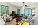 Bright living room with comfortable seating, tile floors, and a ceiling fan at 8205 Sw 78Th Terrace Rd, Ocala, FL 34476