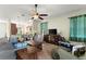 Spacious living room with tile flooring, ceiling fan, and lots of natural light at 8205 Sw 78Th Terrace Rd, Ocala, FL 34476