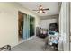 Relaxing covered patio with ceiling fan, sliding glass doors, and outdoor seating at 8205 Sw 78Th Terrace Rd, Ocala, FL 34476