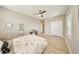 Bright bedroom with wood floors, ceiling fan and large closet space at 8638 Finsen St, Orlando, FL 32827