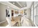 Open dining room with tray ceiling, pendant lights, and view of spiral staircase at 8638 Finsen St, Orlando, FL 32827