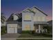 Charming two-story home with a well-manicured lawn, a two car garage, and a covered front porch at 8638 Finsen St, Orlando, FL 32827