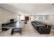 Spacious game room with ping pong table, comfortable seating, and stylish decor at 8638 Finsen St, Orlando, FL 32827